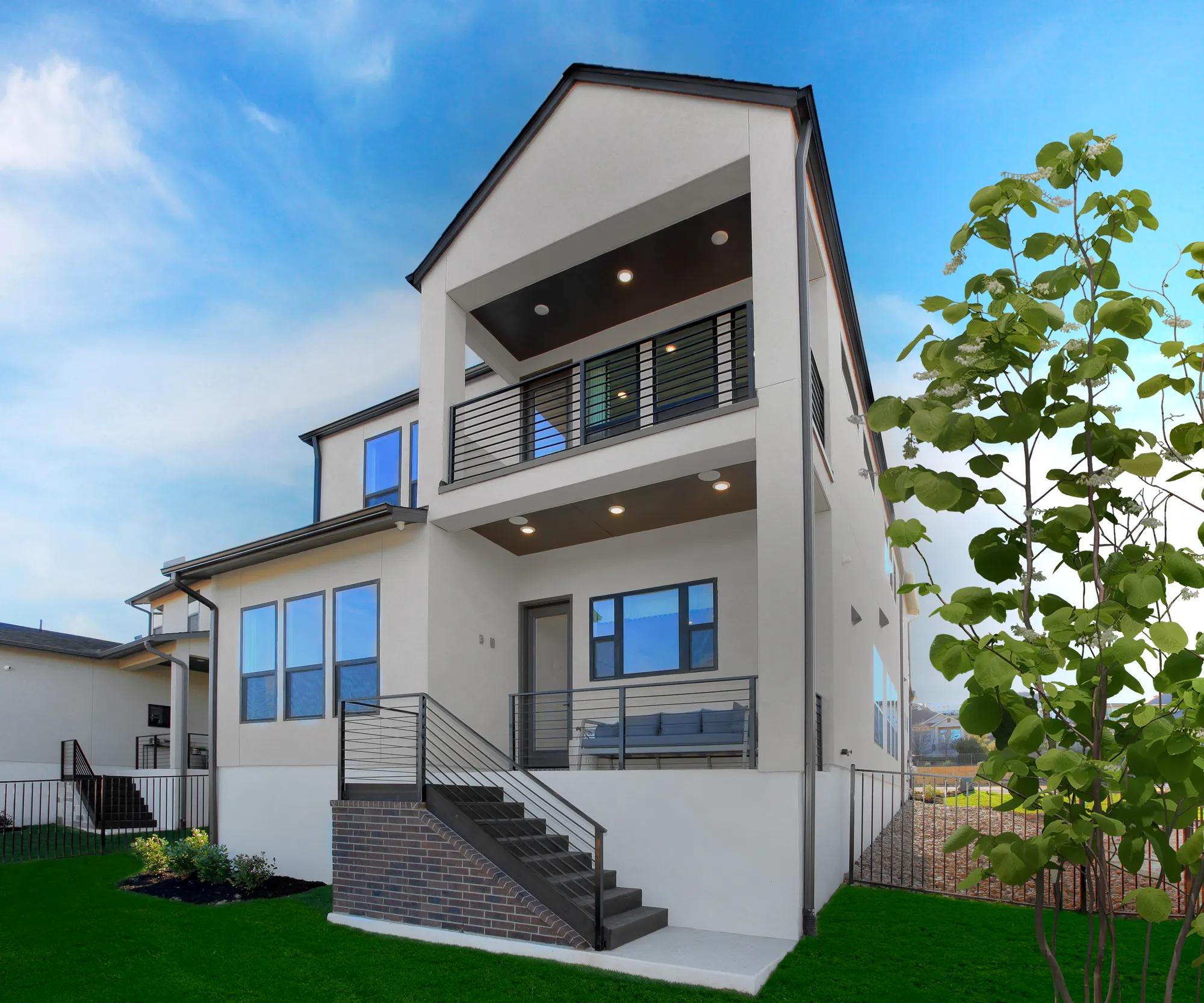 custom Drees home rear exterior with two covered porches
