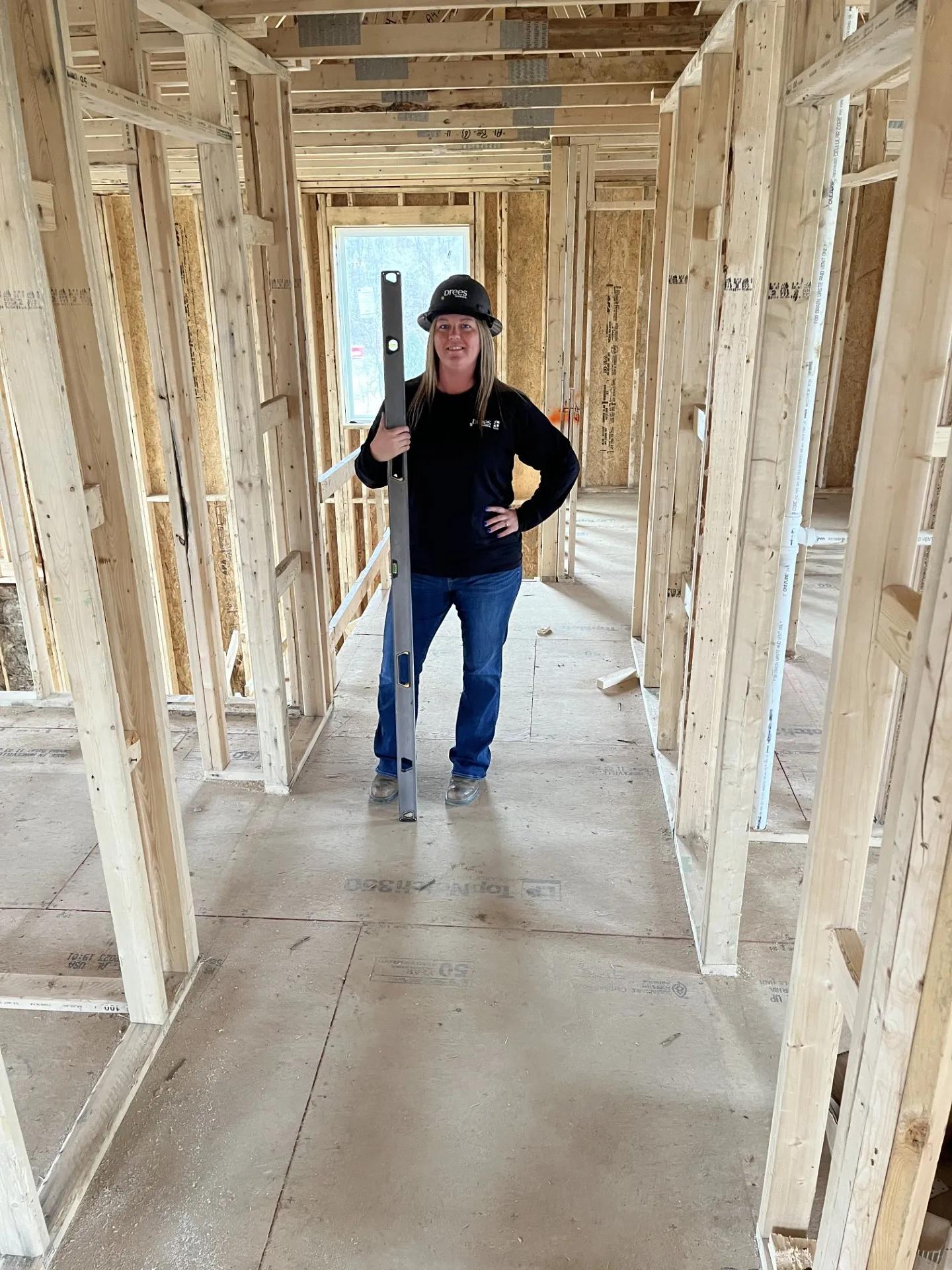 Builder working at new home construction site