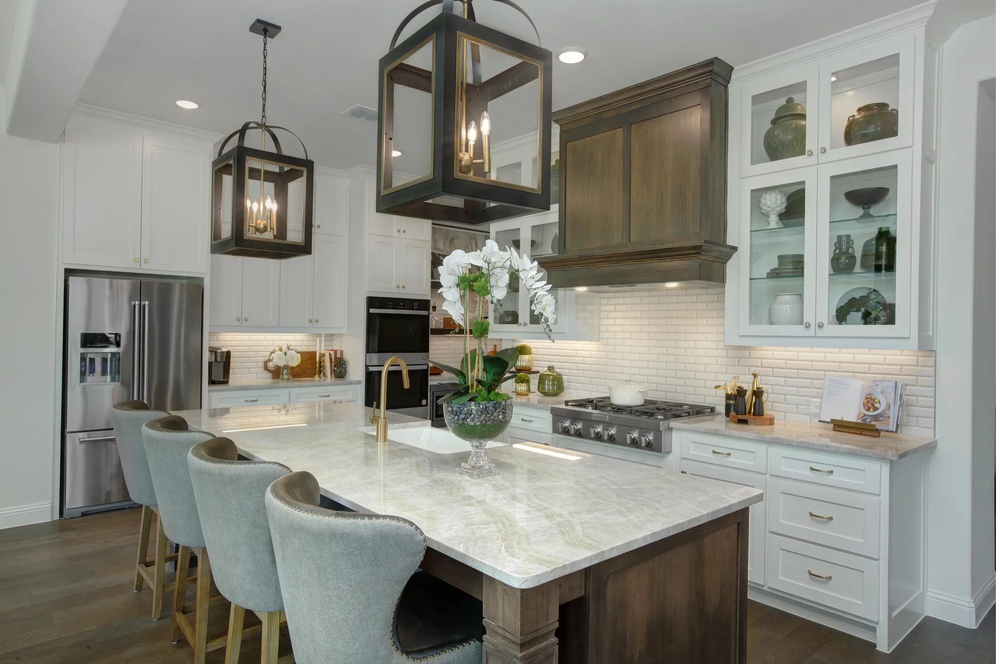 Drees home kitchen with large island and dark wood cabinets