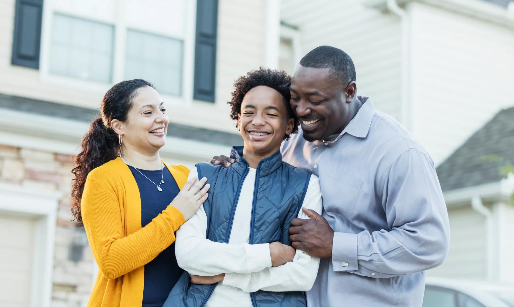 Family in front of home