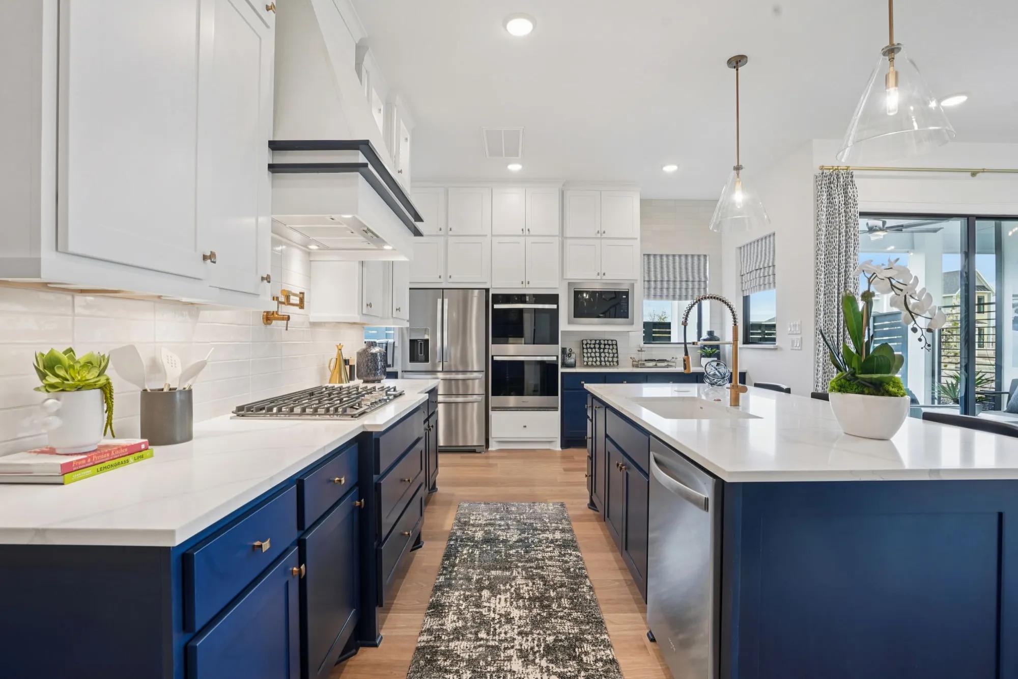 new home kitchen with white and blue cabinets