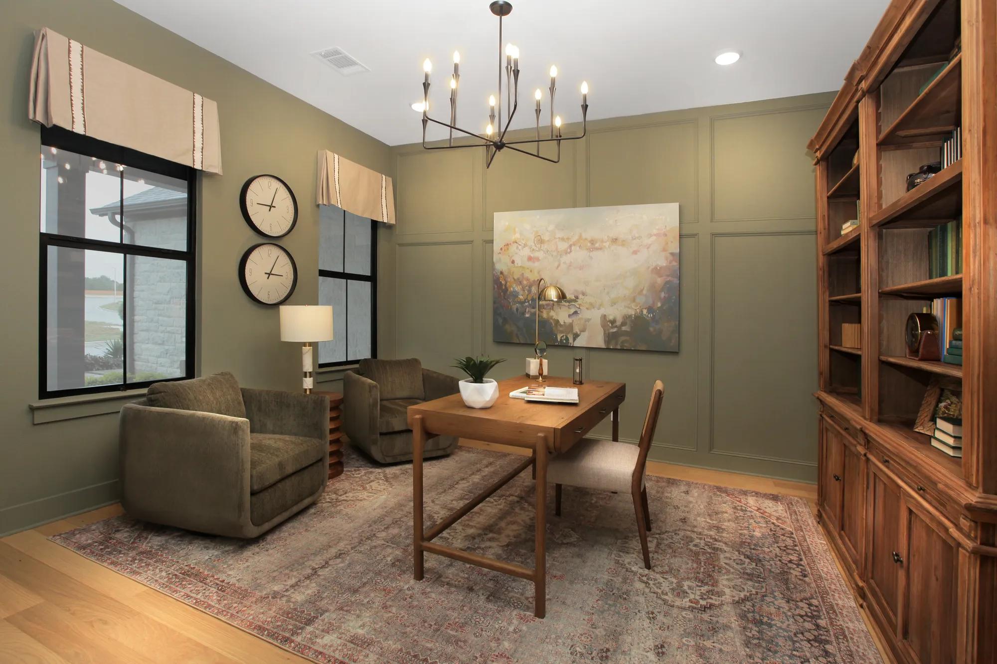 home office with built-in dark wood shelves