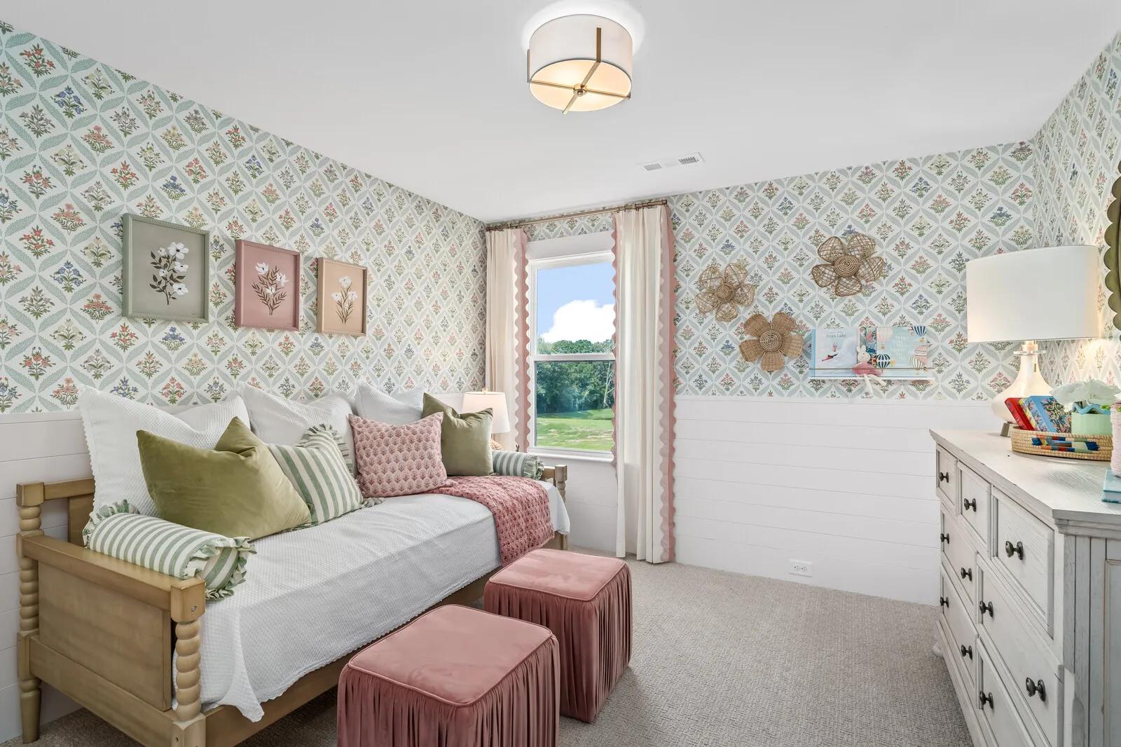 Custom home bedroom with floral wallpaper and shiplap accent