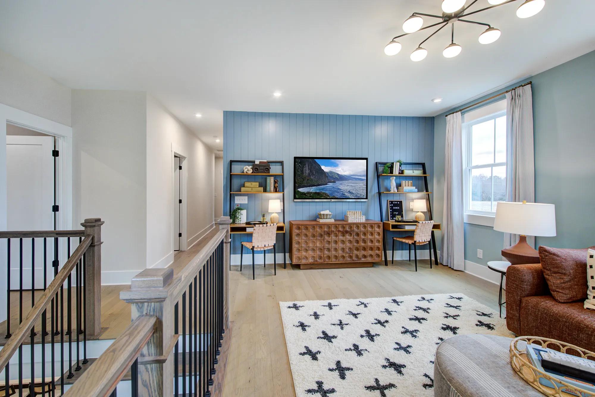 Custom home upstairs gameroom with blue panel accent wall