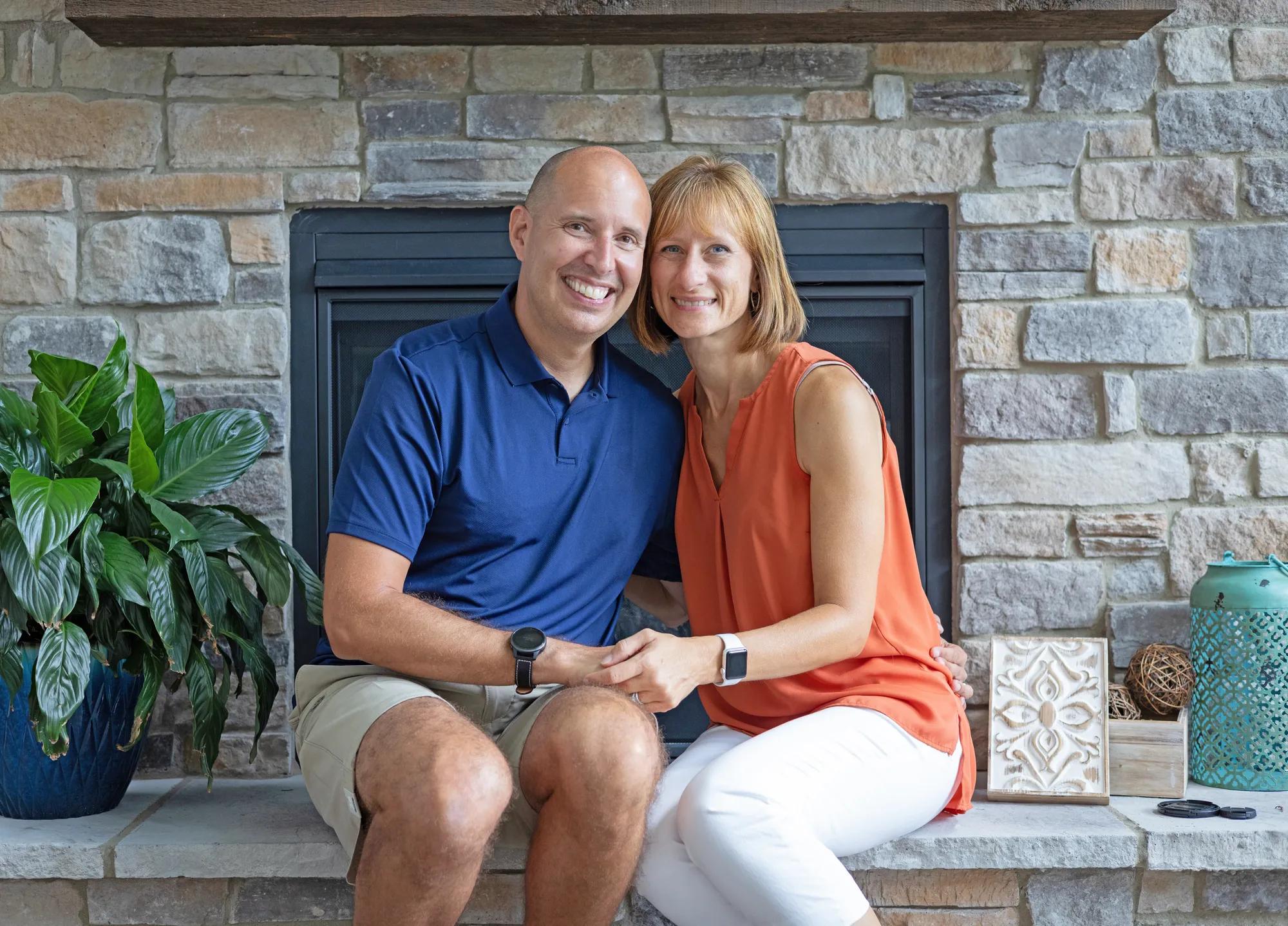 New Drees homeowners enjoying the charming Buchanan stone fireplace