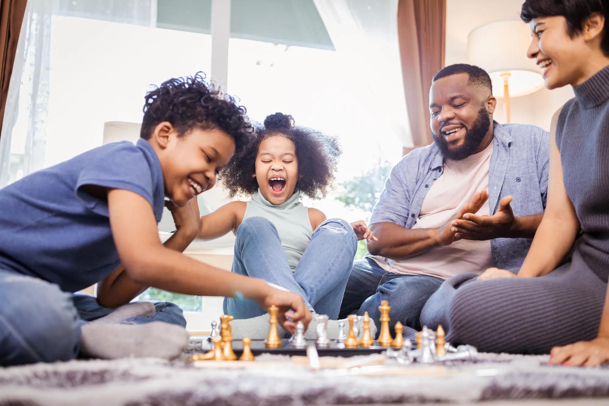 Family playing games in new home