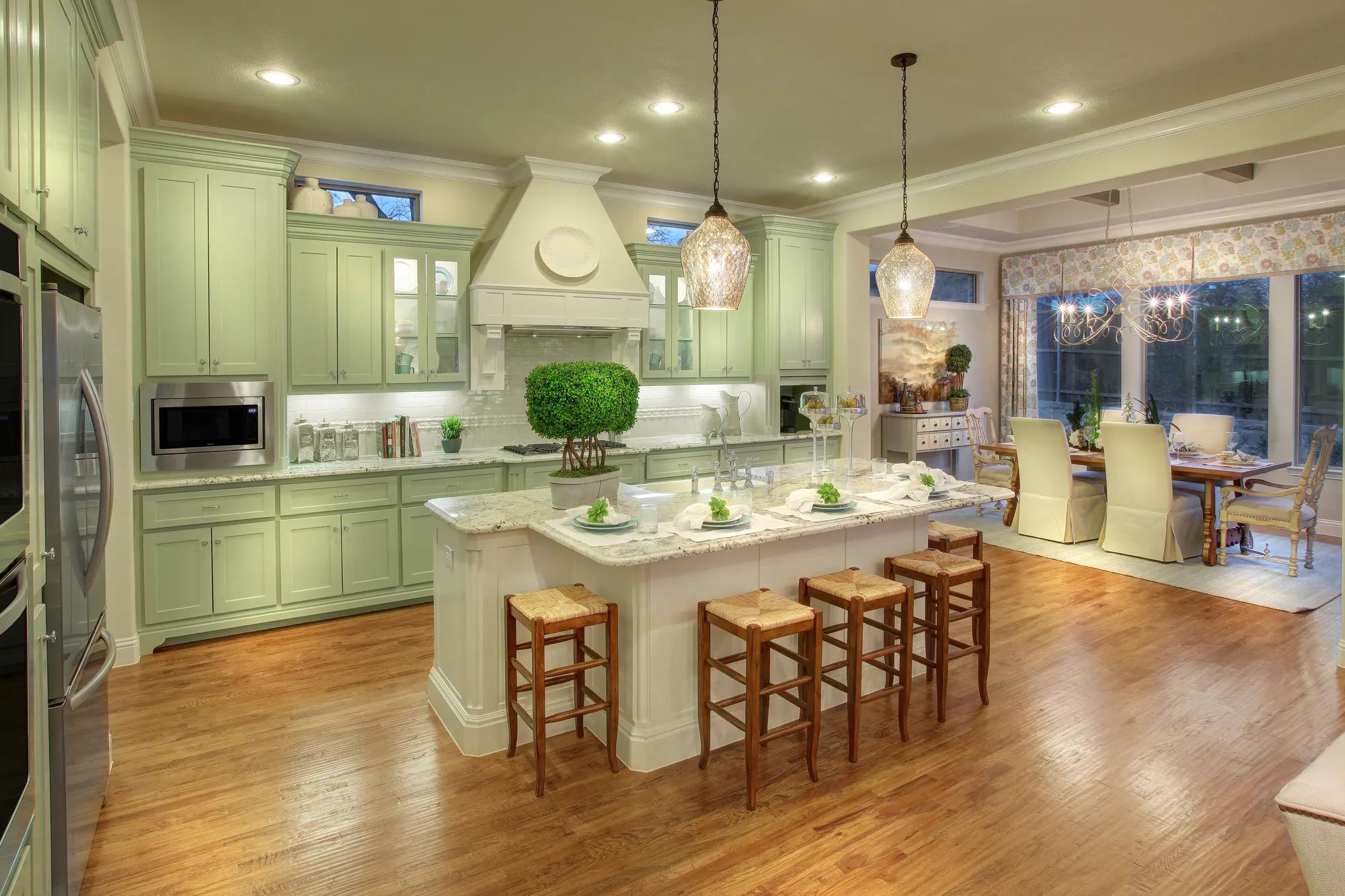 kitchen with pistachio cabinets and stainless steel appliances