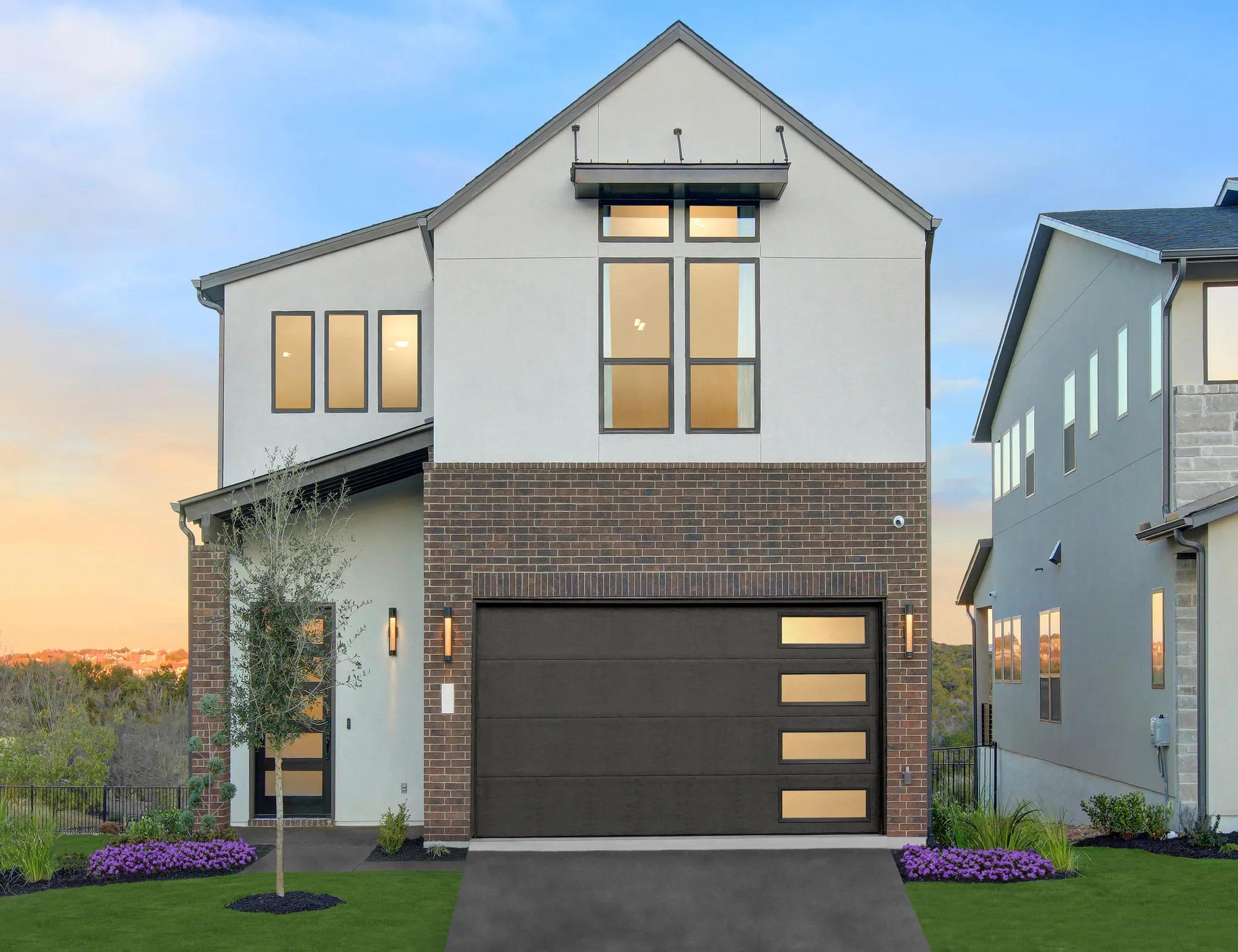 custom home with brick and stucco exterior