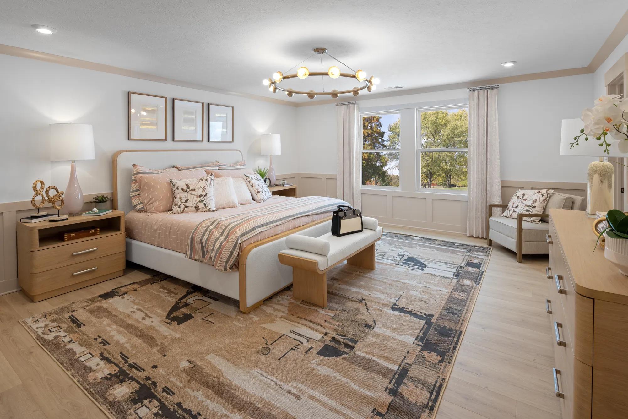 primary bedroom with crown moulding
