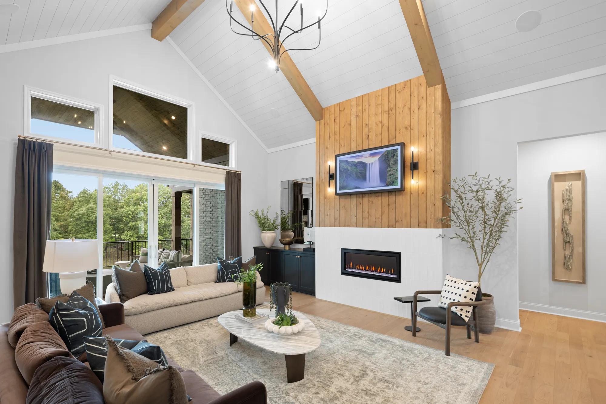 Custom home family room with light wood fireplace