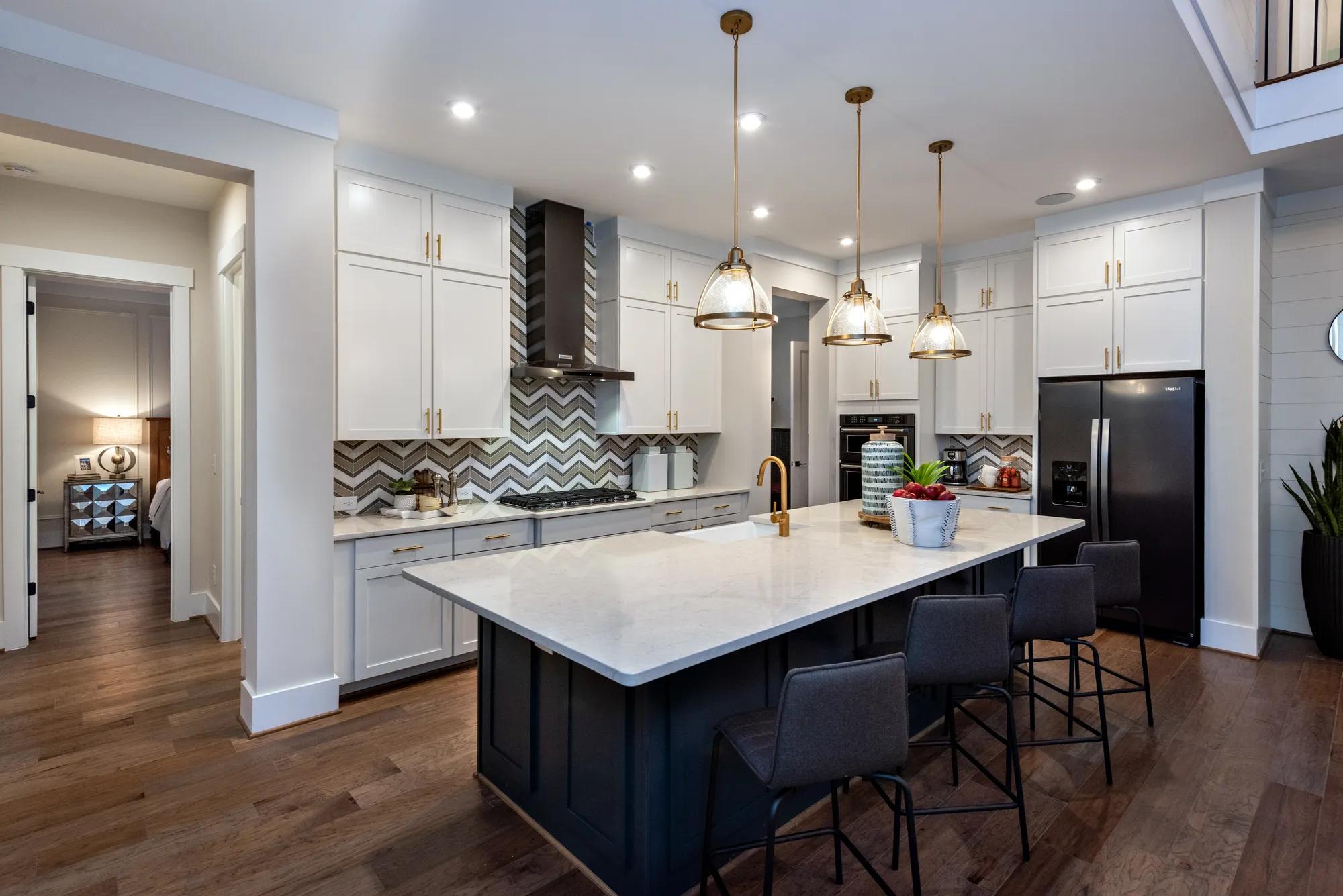 kitchen with large island and white cabinets